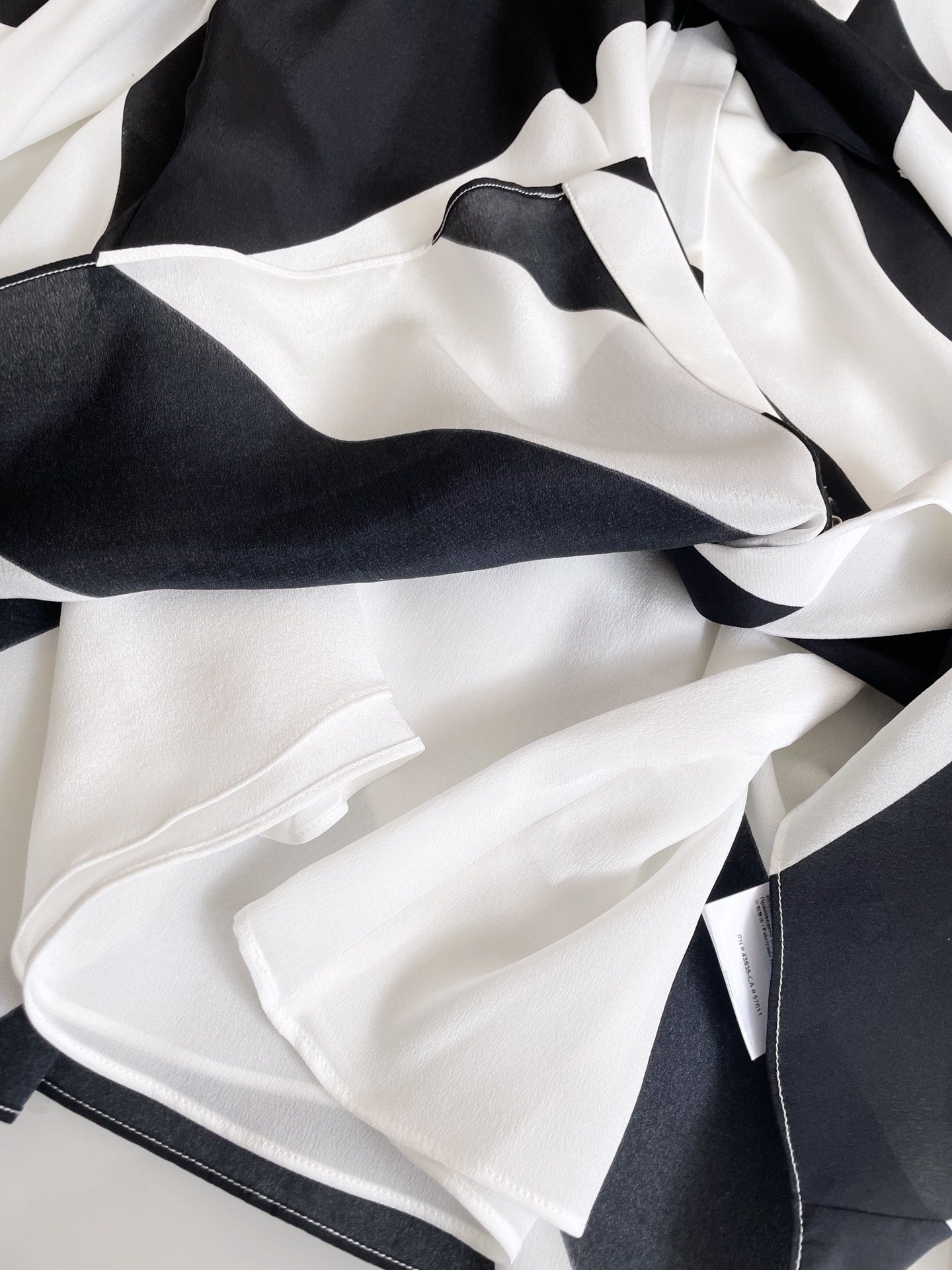 Spring/Summer 24 Black and white silk bow tie blouse