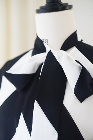 Spring/Summer 24 Black and white silk bow tie blouse