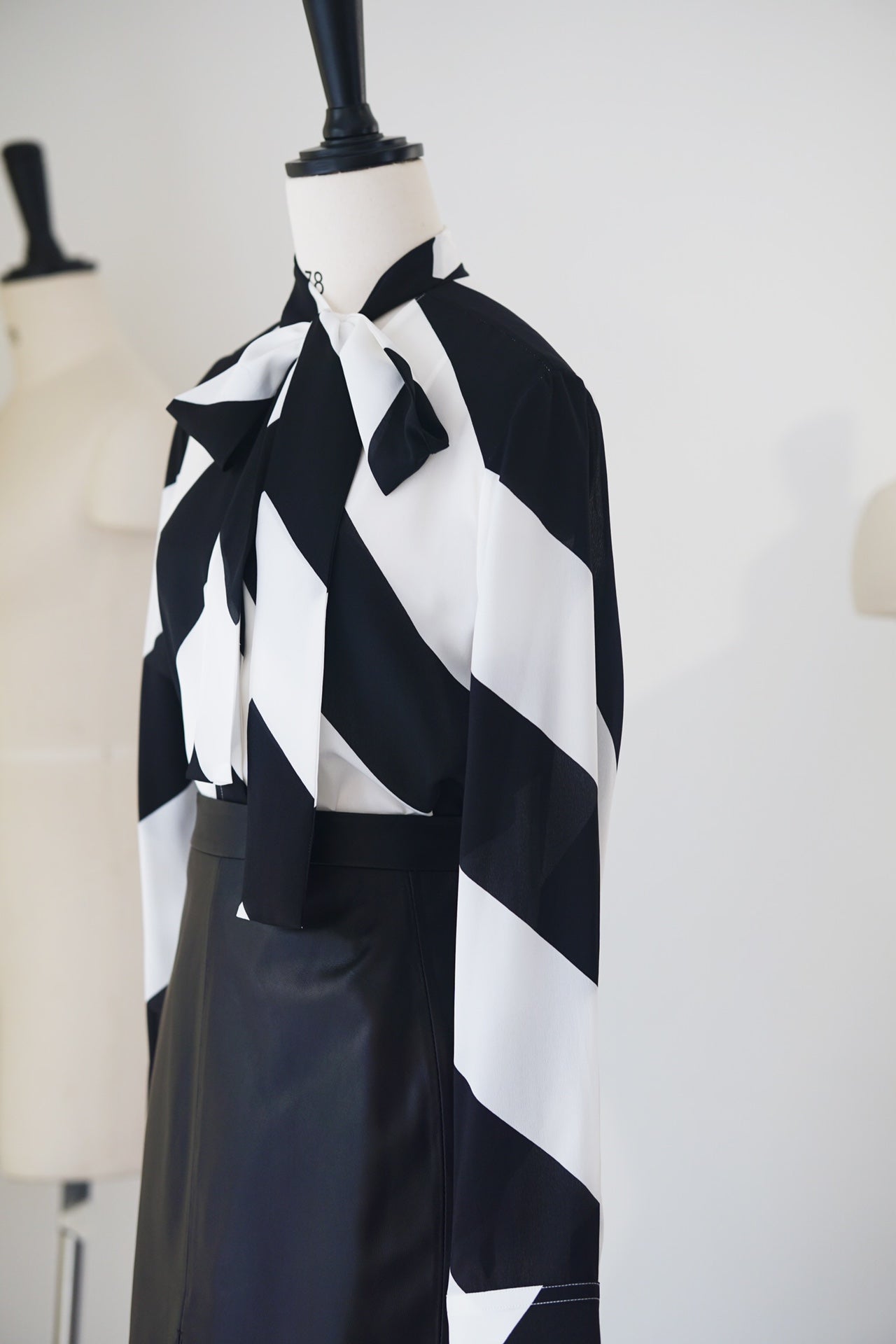 Spring/Summer 24 Black and white silk bow tie blouse