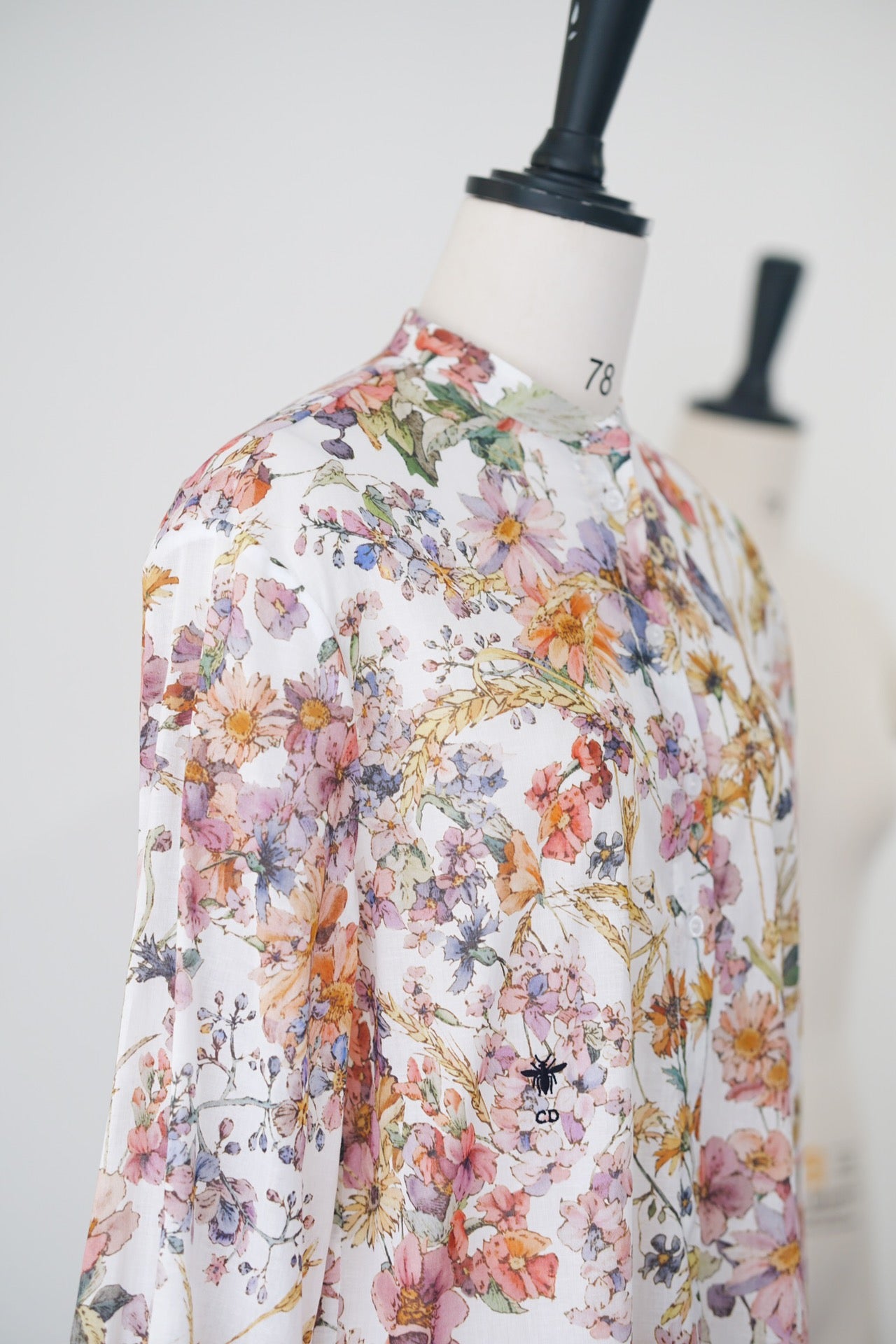 Spring/Summer 24 Bee embroidered floral silk blouse.