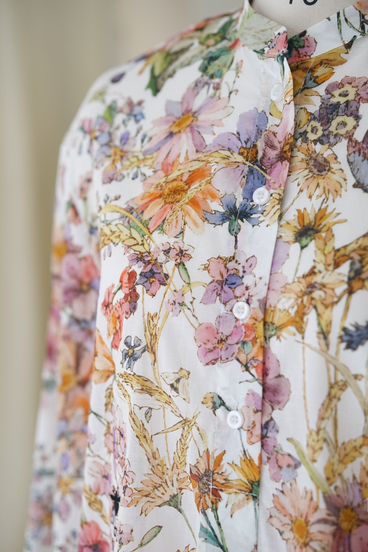 Spring/Summer 24 Bee embroidered floral silk blouse.