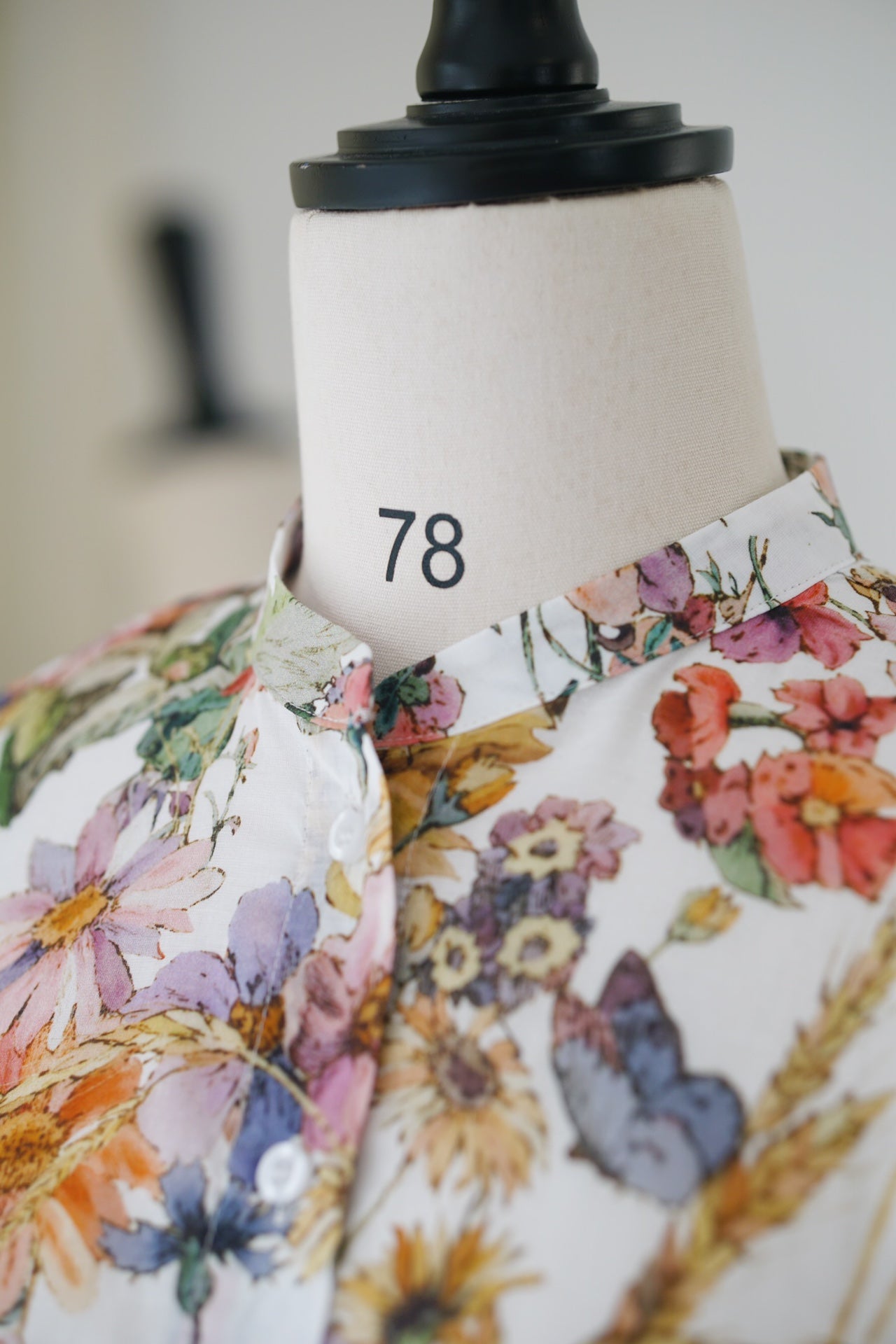 Spring/Summer 24 Bee embroidered floral silk blouse.